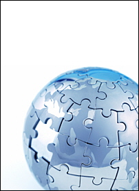 world globe covered in jigsaw puzzle pieces